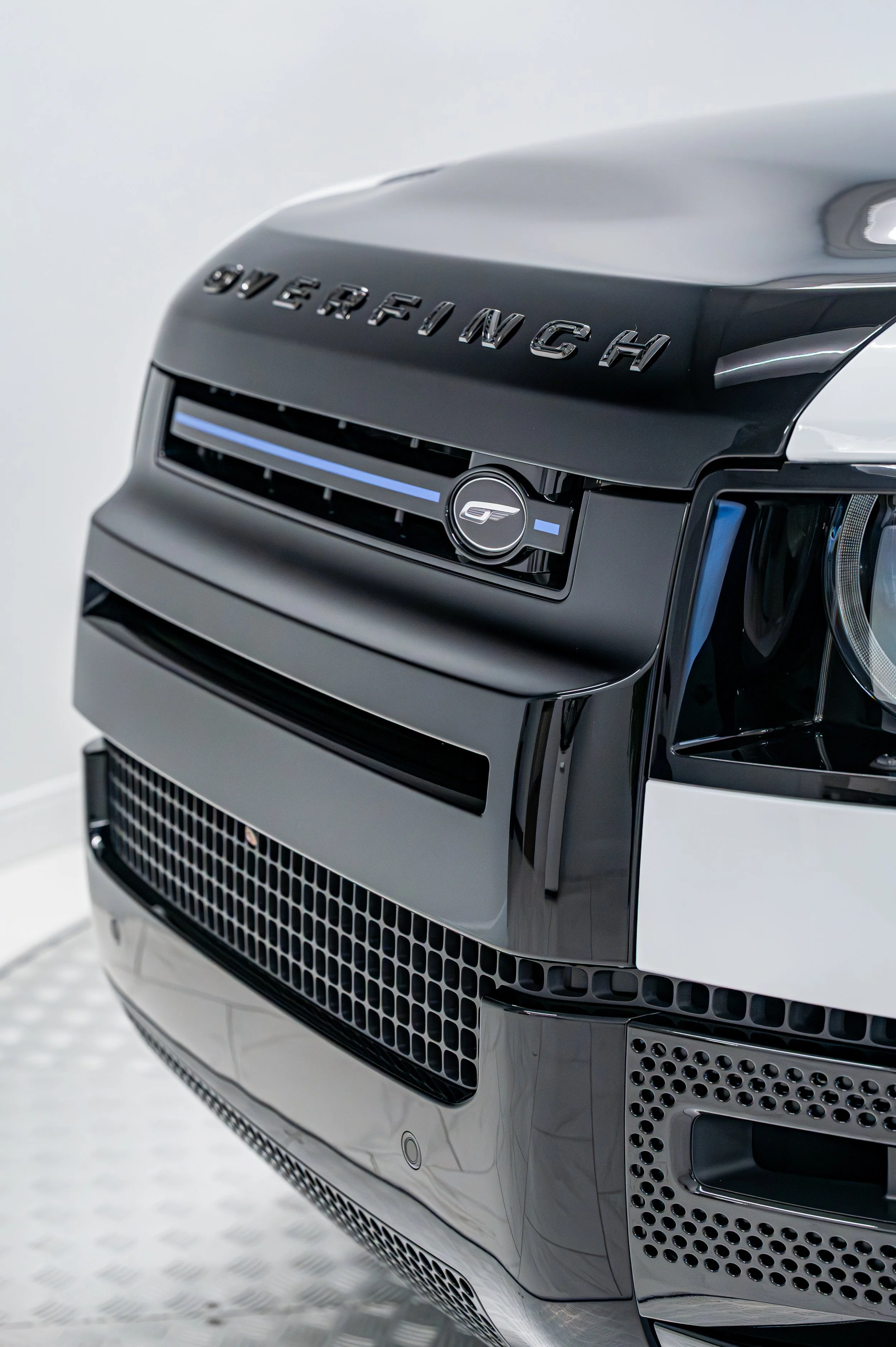 Detail photograph of a customized black Overfinch Defender grille at KTL Restorations
